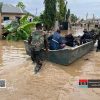 Flooded streets in Accra with emergency teams rescuing residents during heavy rainfall