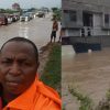 Floodwaters covering a major road in Accra as vehicles move cautiously following heavy rains on June 29, 2026.
