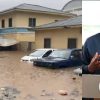 Flooded streets in Accra with submerged vehicles
