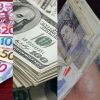 Ghana cedi notes alongside US dollar, British pound and euro currencies after the cedi's strong appreciation