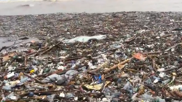 Plastic and other solid waste washed onto Laboma Beach after floodwaters carried debris through the Odaw drain following heavy rainfall in Accra.