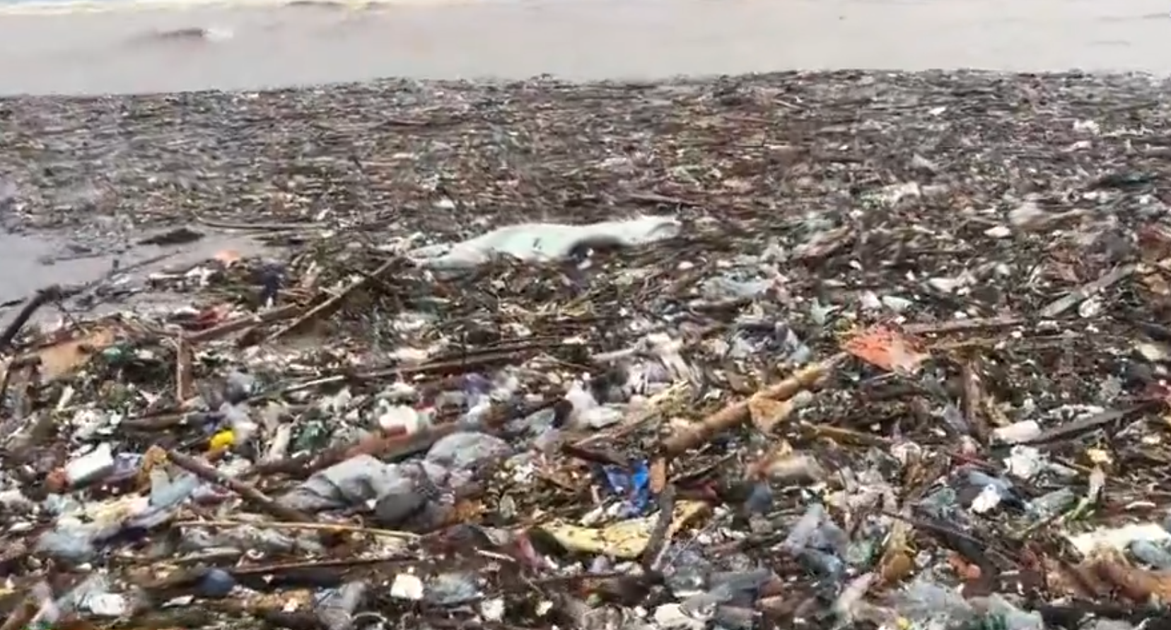 Plastic and other solid waste washed onto Laboma Beach after floodwaters carried debris through the Odaw drain following heavy rainfall in Accra.
