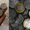 A Ghanaian trader accepts GH¢1, GH¢2 and pesewa coins from a customer at a busy market following the Bank of Ghana's legal tender warning.