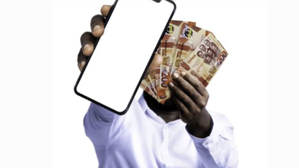 Person checking a suspicious online investment message on a smartphone while protecting money from fraud