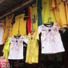 Unsold Black Stars jerseys and football merchandise displayed at a market stall after Ghana's World Cup exit